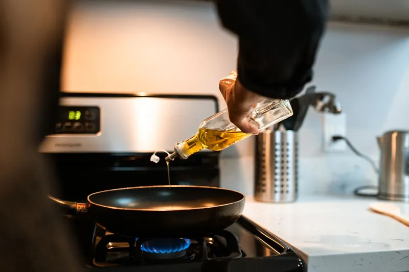 Olive oil being poured, close up